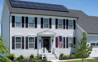 A large home with a solar array on the rooftop.